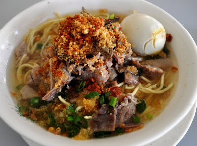 Batchoy (Miki noodles in a pork broth topped with pork organs, leeks, chicharon, and an egg) courtesy of the original Ted's La Paz Batchoy in Iloilo.