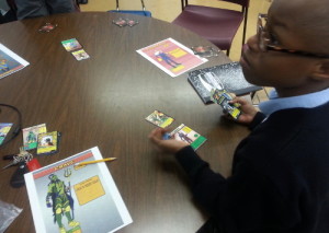Student works during extended learning time on his superhero.