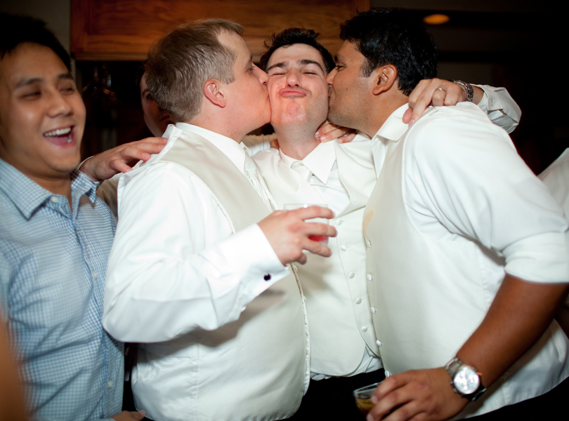 groom kisses, The Hills Country Club Wedding, shots at the bar