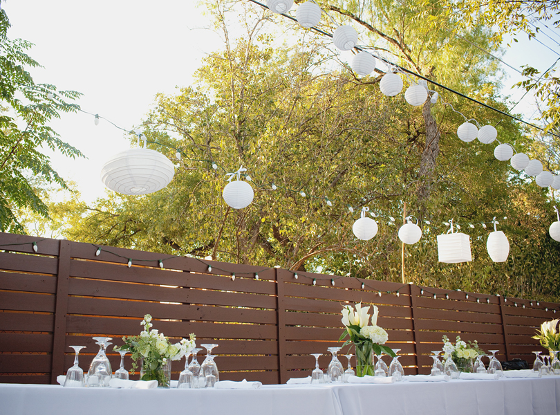 charming south austin backyard wedding, whole foods, DIY, austin wedding photographer, table setting, fence, sunset