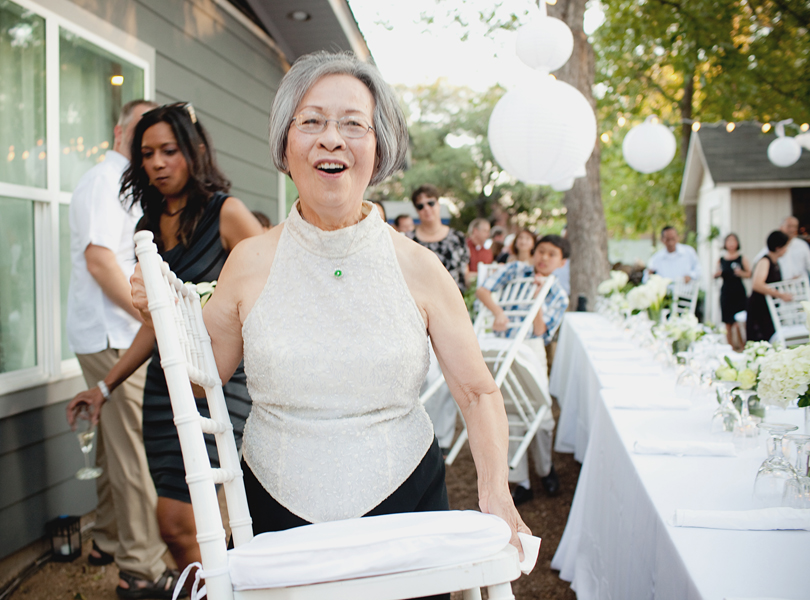 charming south austin backyard wedding, whole foods, DIY, mother of the bride, carrying a chair, flipping the wedding,