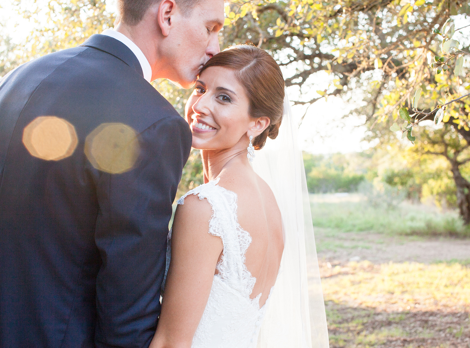 Vista West Ranch Wedding Photography, Dripping Springs Wedding Photography, Austin Weddings, Coordinate This, lacy bridal gown, backless wedding dress, bride and groom posing together in the setting sunlight, peaceful, Outdoor wedding, nature 
