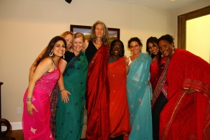 women playing dress up in saris