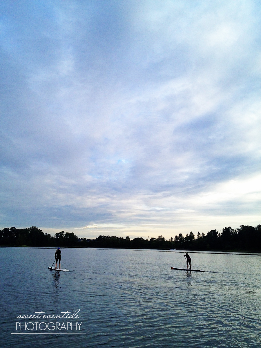 two stand up paddleboarders willamette river portland oregon
