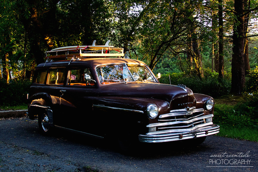 vintage Plymouth station wagon with surf boards 
