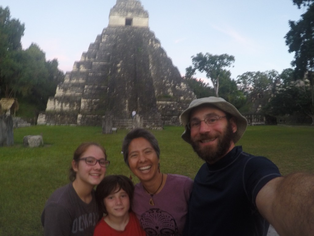 Vanamos family is all smiles for a photo in front of the Jaguar Temple, despite a long trek to the Gran Plaza at Tikal through a mosquito and heat laden jungle. 