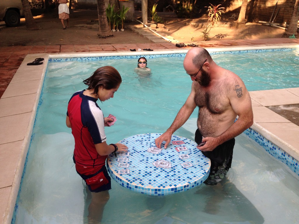 Coconut and I playing cards in the pool. We played "Spit in the Pool" which is the card game spit, but played while in the pool. Clever, eh?