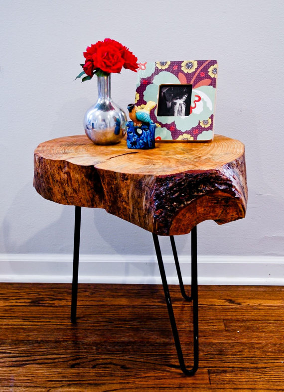 Tree trunk table top with black hairpin legs.