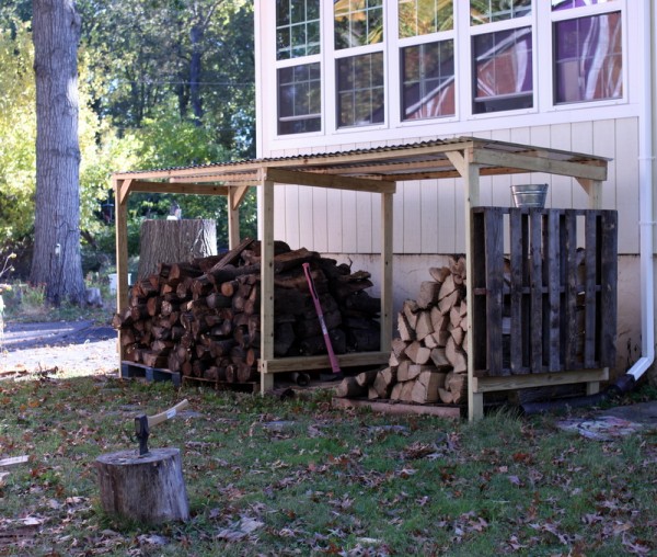 simple woodshed with pallet sides