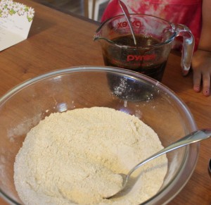 child mixing gingersnap cookies recipe