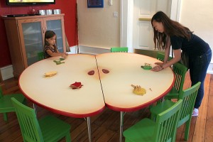playing games around apple shaped table