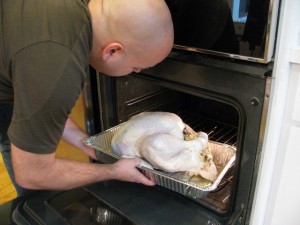 placing turkey in oven