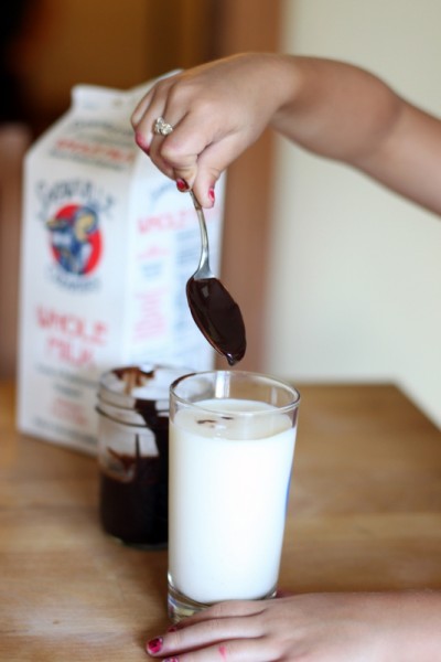 dropping homemade chocolate into snowville milk