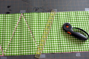 cutting oilcloth for bunting