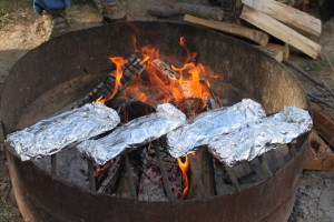 potato packets over fire