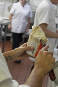 hand packing pints of salty caramel ice cream jeni's ohio