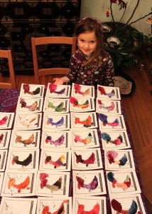 child and her hand painted cards