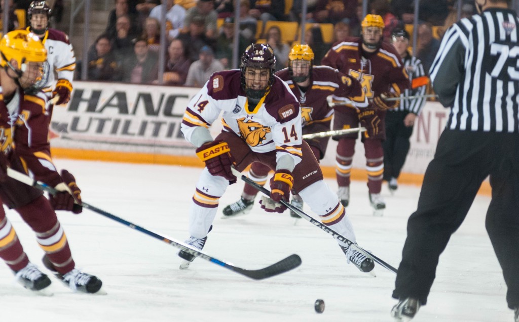 Alex Iafallo chases a loose puck in tonight's win over the Gophers. ALEX GANEEV/STATESMAN