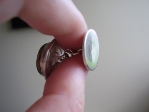 Side view of cufflinks, showing the sterling silver chain connector