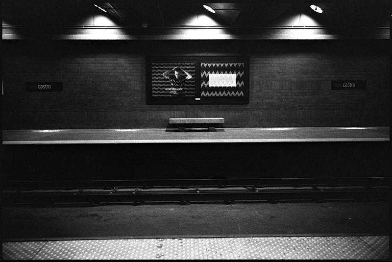 black and white photo castro street muni station san francisco