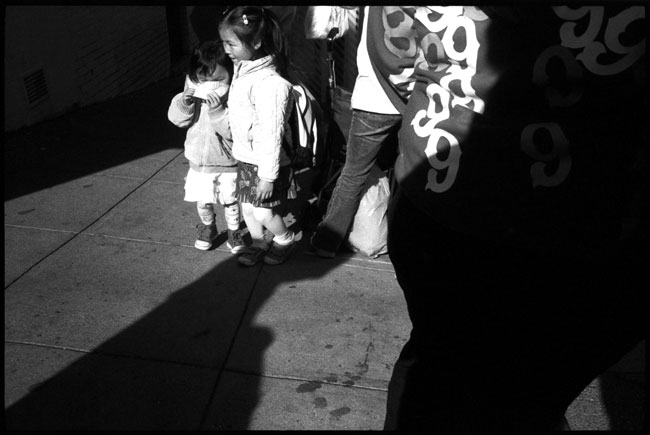 Black And White Photograph: Children, Bus Stop, Chinatown