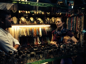 Leah purchasing beads and raw materials from a vendor in Mumbai, India
