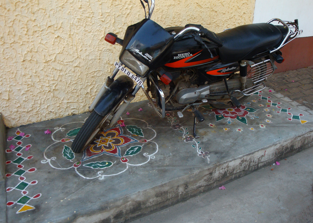 rangoli beneath bike