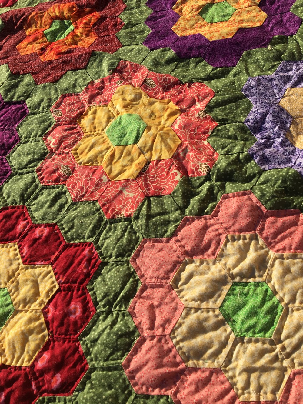 As much as I love the look of the hand stitching, I do not have the time to do so. I also don't love this quilt as much as I once did 7 years ago so it won't get the attention the I would need to give.