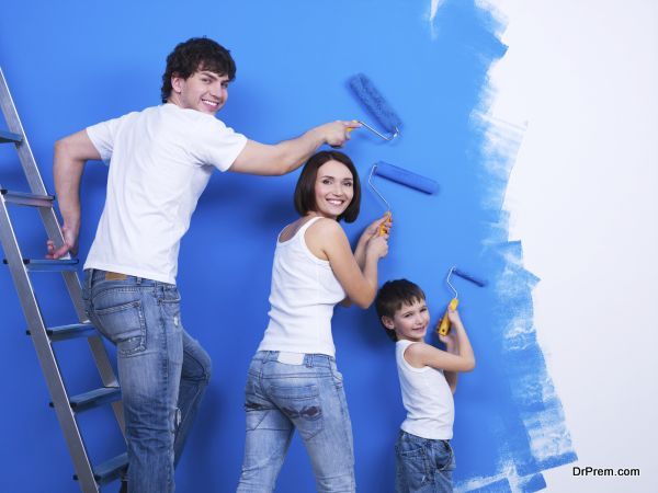 Young family painting the wall