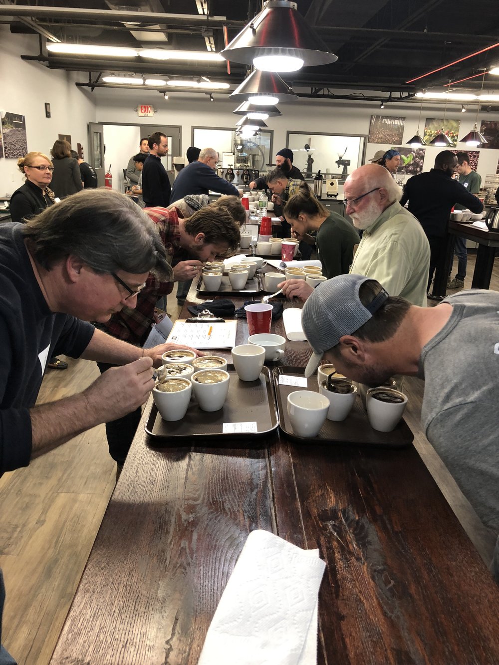 Coffee cupping in progress during a Colombian micro lot specialty coffee cupping event at The Lab by Royal New York