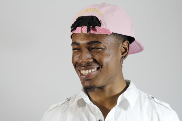 happy-young-man-in-pink-hat-640x427