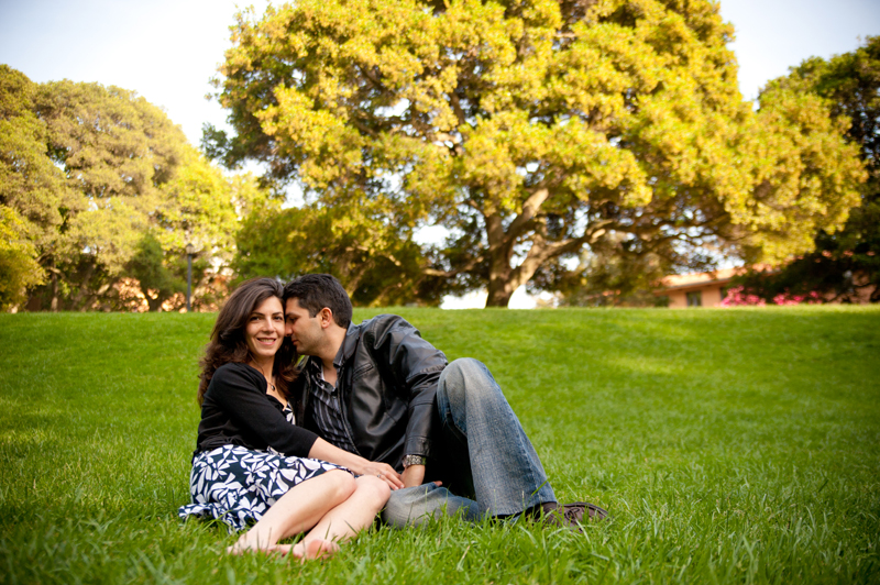 Couple sitting on grass at Faculty Glade