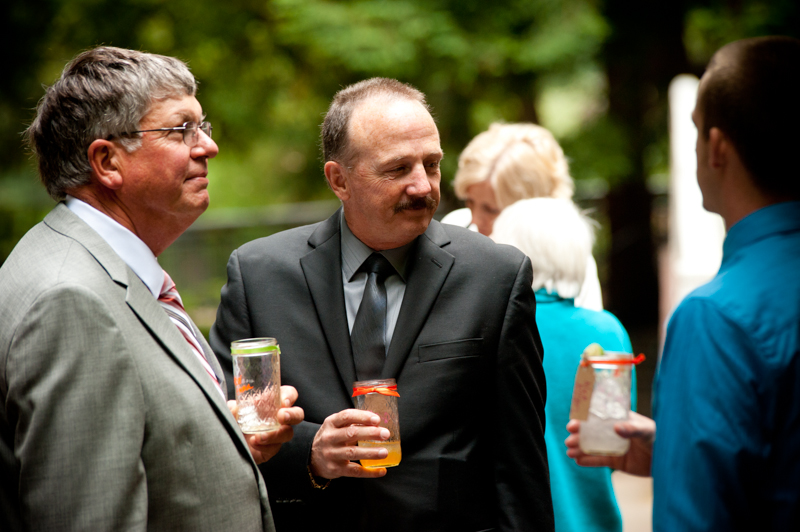 Candid photo of fathers of Bride during cocktail hour
