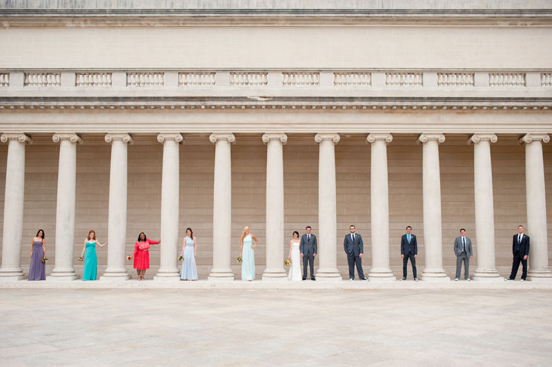 Wedding party in between columns at The Legion of Honor