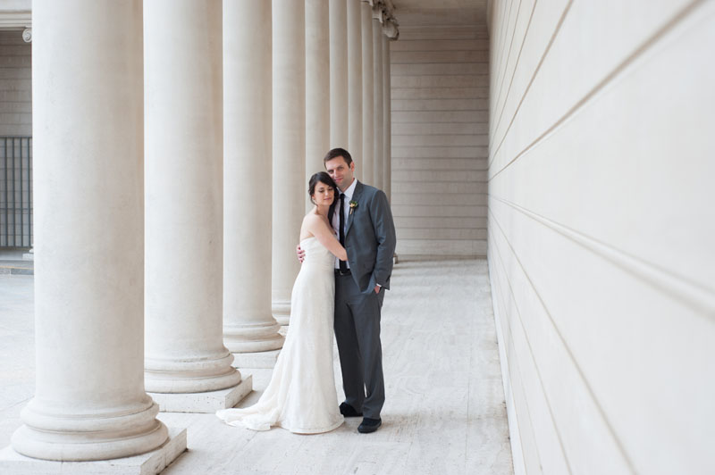 Bride and Groom with columns at The Legion of Honor in San Francisco