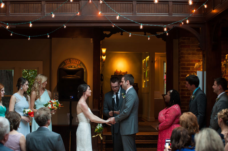 Bride and Groom holding hands during ceremony at the Tavern at Lark Creek