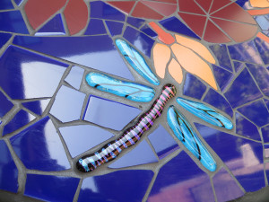 Fused glass dragonfly by JoAnn Wellner.