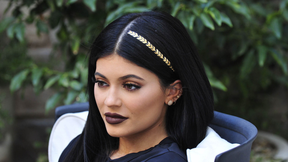 - Los Angeles, CA - 10/19/2015 - Kylie Jenner shows off one of the new scunci hair tattoos while playing with her pups at a shoot. -PICTURED: Kylie Jenner -PHOTO by: Michael Simon/startraksphoto.com -MS_287598 Editorial - Rights Managed Image - Please contact www.startraksphoto.com for licensing fee Startraks Photo Startraks Photo New York, NY  For licensing please call 212-414-9464 or email sales@startraksphoto.com Image may not be published in any way that is or might be deemed defamatory, libelous, pornographic, or obscene. Please consult our sales department for any clarification or question you may have Startraks Photo reserves the right to pursue unauthorized users of this image. If you violate our intellectual property you may be liable for actual damages, loss of income, and profits you derive from the use of this image, and where appropriate, the cost of collection and/or statutory damages.
