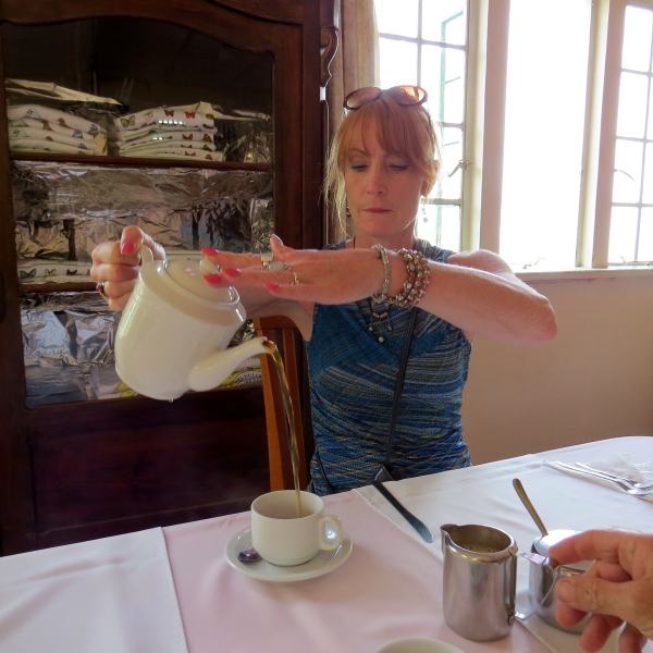 lin pours tea at pax house trinidad