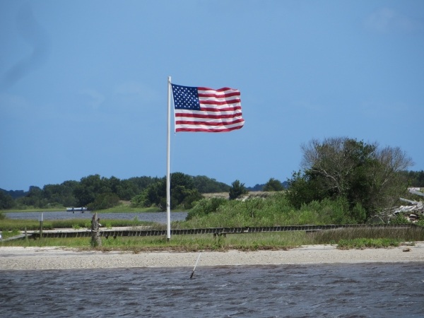 wind blown flag on the intracoastal waterway