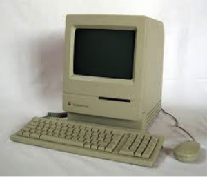 The original Apple Macintosh that pioneered the widespread use of graphical interface and mouse in personal computing.