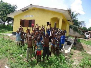 Children excited in front of the resource center.