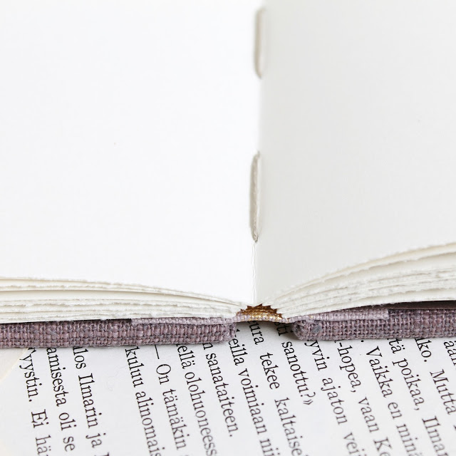 coptic bound guest book with distressed gold spine by Kaija Rantakari / paperiaarre.com