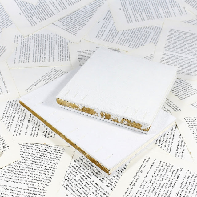coptic bouond books with distressed gold linen spines - Kaija Rantakari / paperiaarre.com