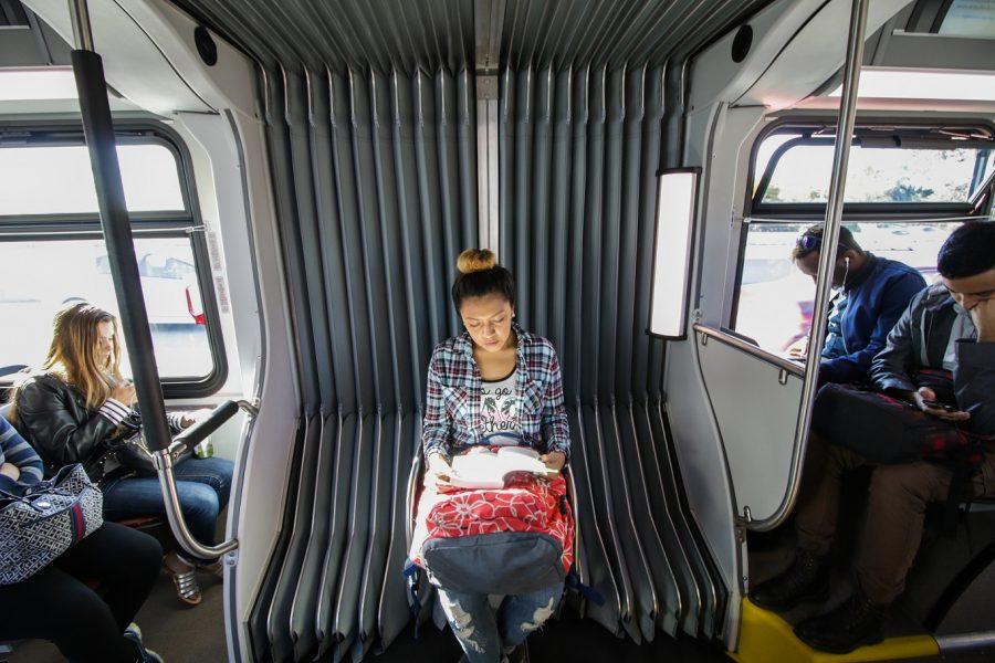 Brenda De Angel, a student at Santa Monica College, and member of the FLVR program maximizes time by reading on her hour long commute to campus on March 15, 2016.