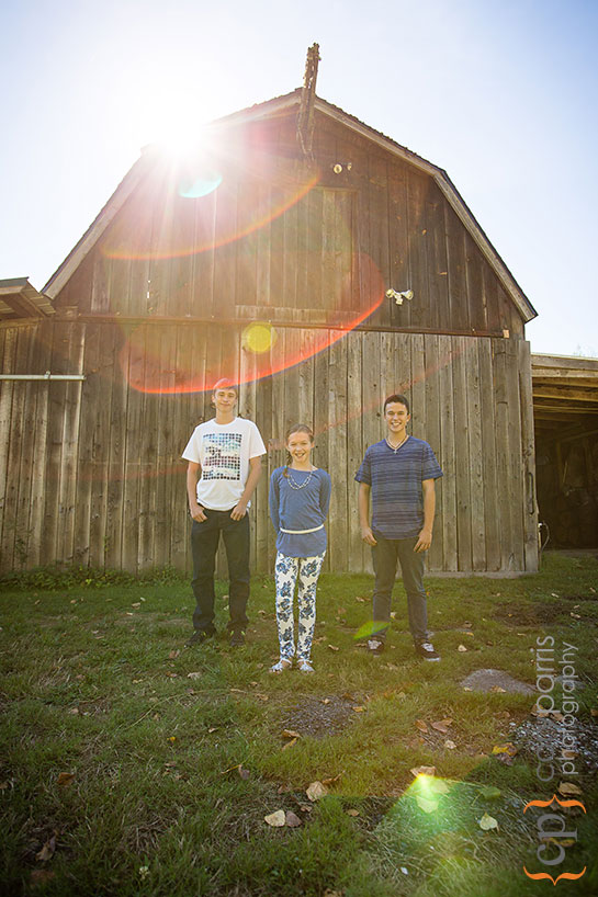three kids and sunflare portrait in woodinville