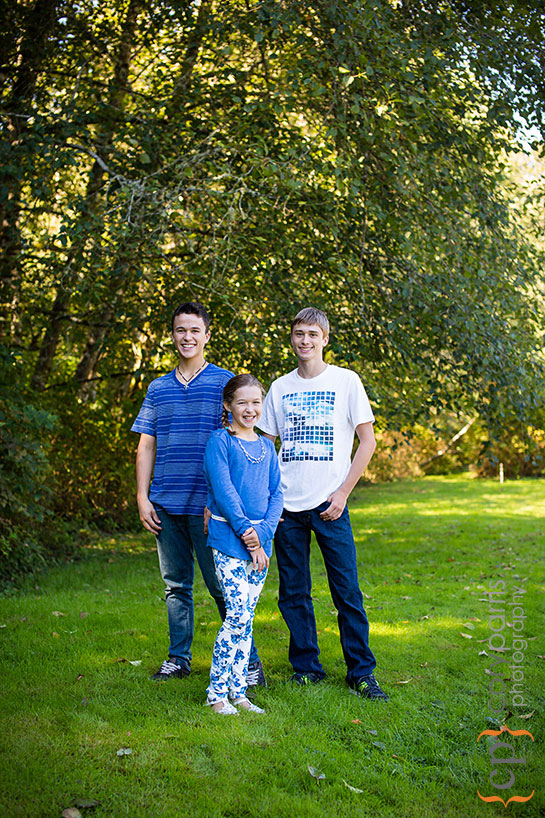 portrait of three kids in the woods