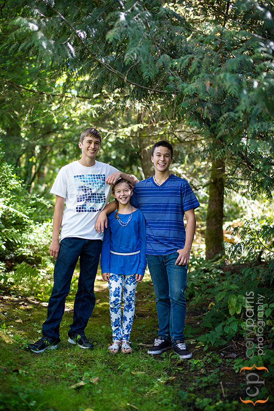 portrait of three kids in the woods