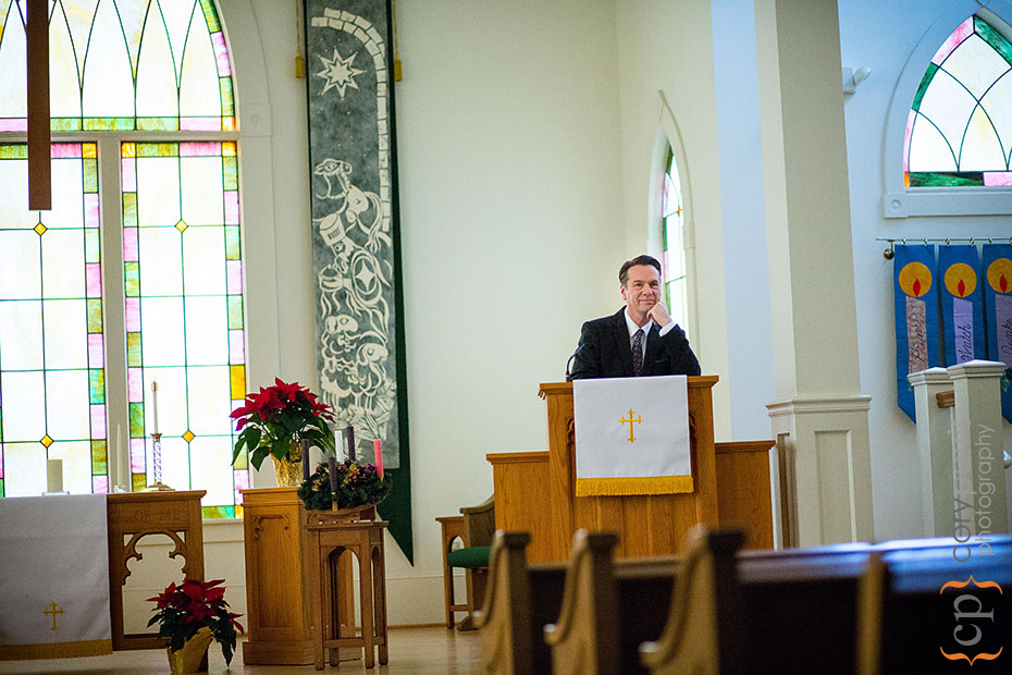 man standing at a pulpit