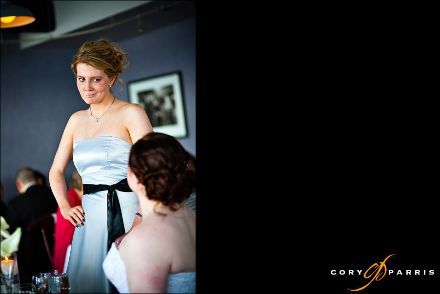 bridesmaid talking with the bride by seattle wedding photojournalist cory parris